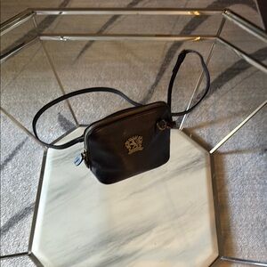 Black Crossbody Bag with Structured Design and Gold Accents